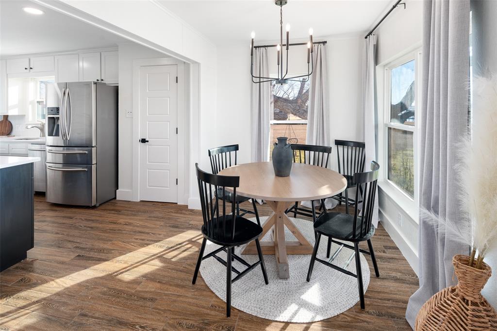 1169 Willow Road Graford, TX 76449 - Photo 22 of 40 a view of a dining room with furniture window and wooden floor