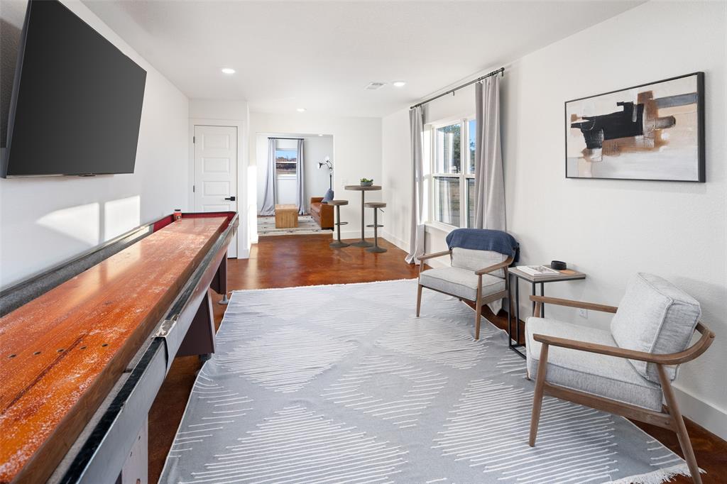 1169 Willow Road Graford, TX 76449 - Photo 30 of 40 a living room with furniture and a flat screen tv