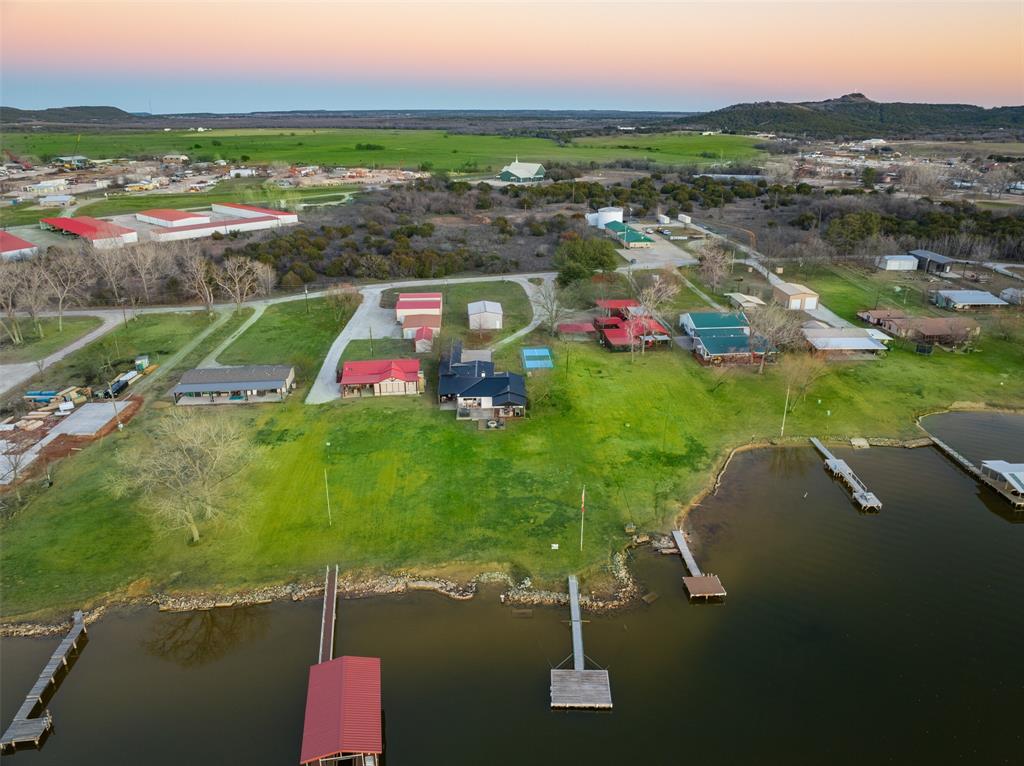 1169 Willow Road Graford, TX 76449 - Photo 40 of 40 an aerial view of residential houses with outdoor space and river