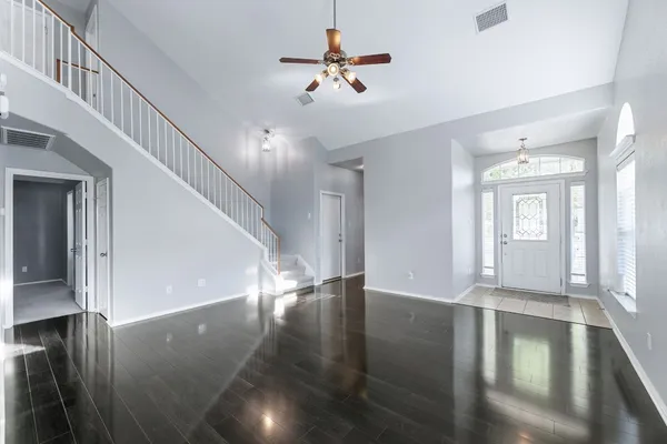 a view of an entryway with wooden floor