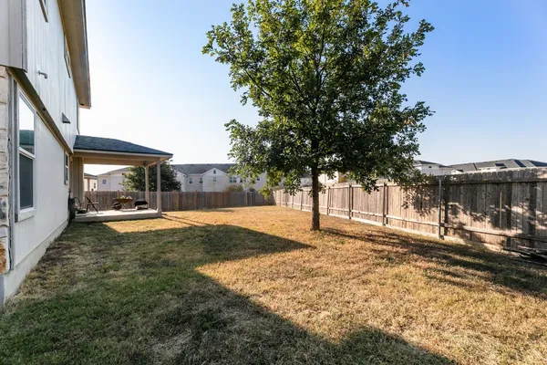 a view of a yard with car parked