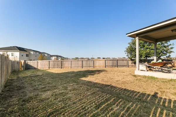 a view of a backyard of the house