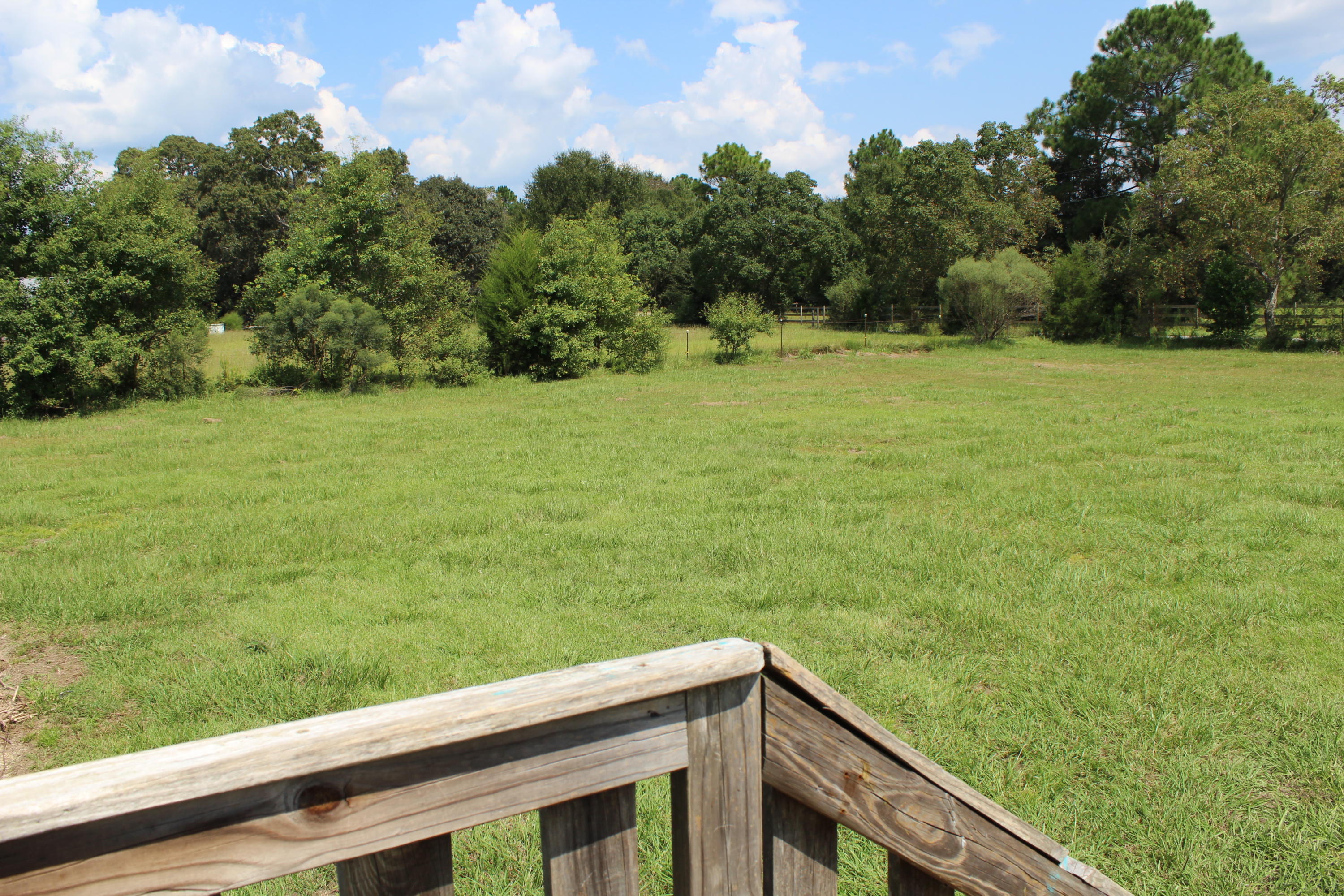 5072 Griffith Mill Road Holt, FL 32564 - Photo 18 of 22 a view of a field with an outdoor space