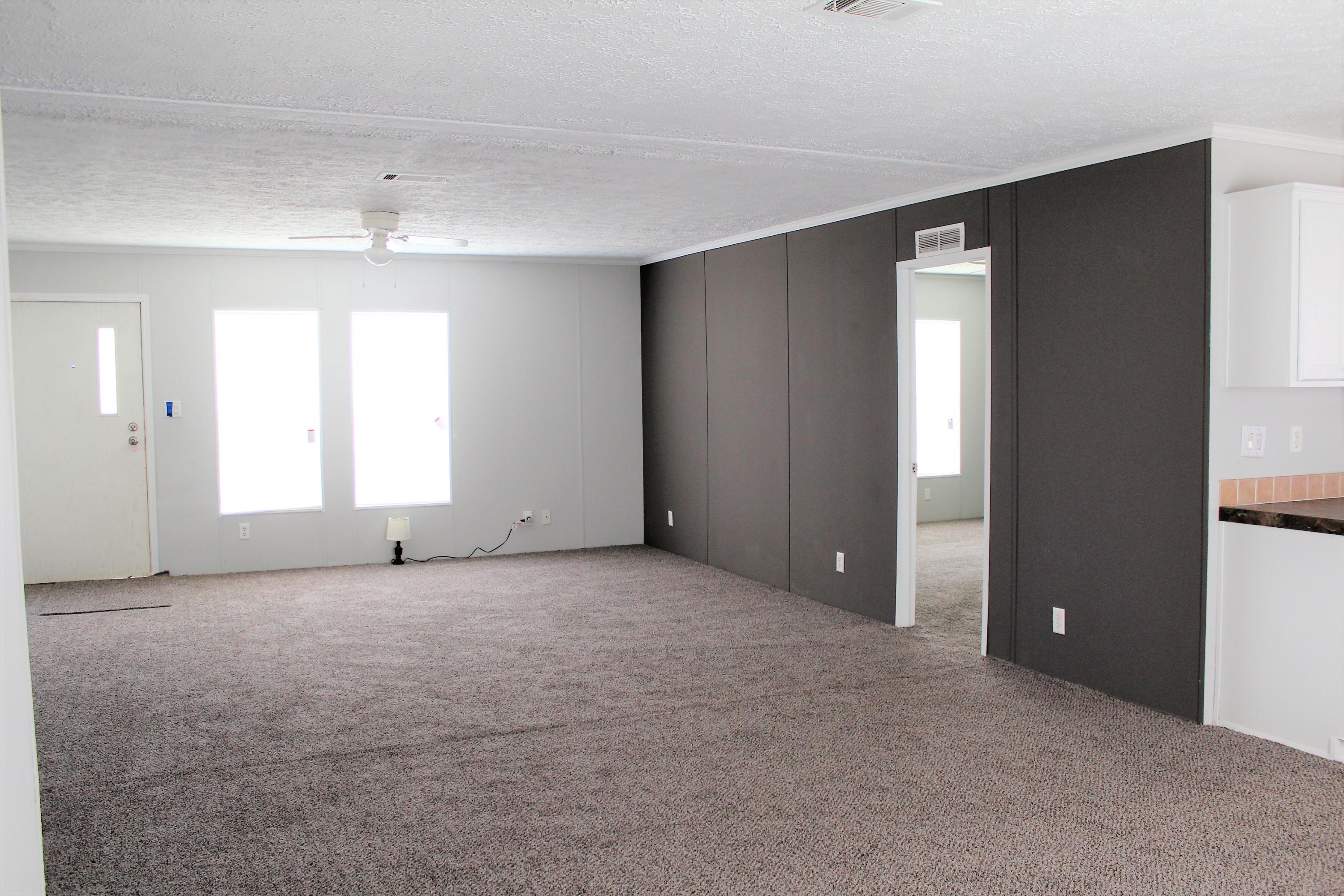 5072 Griffith Mill Road Holt, FL 32564 - Photo 2 of 22 an empty room with windows and closet