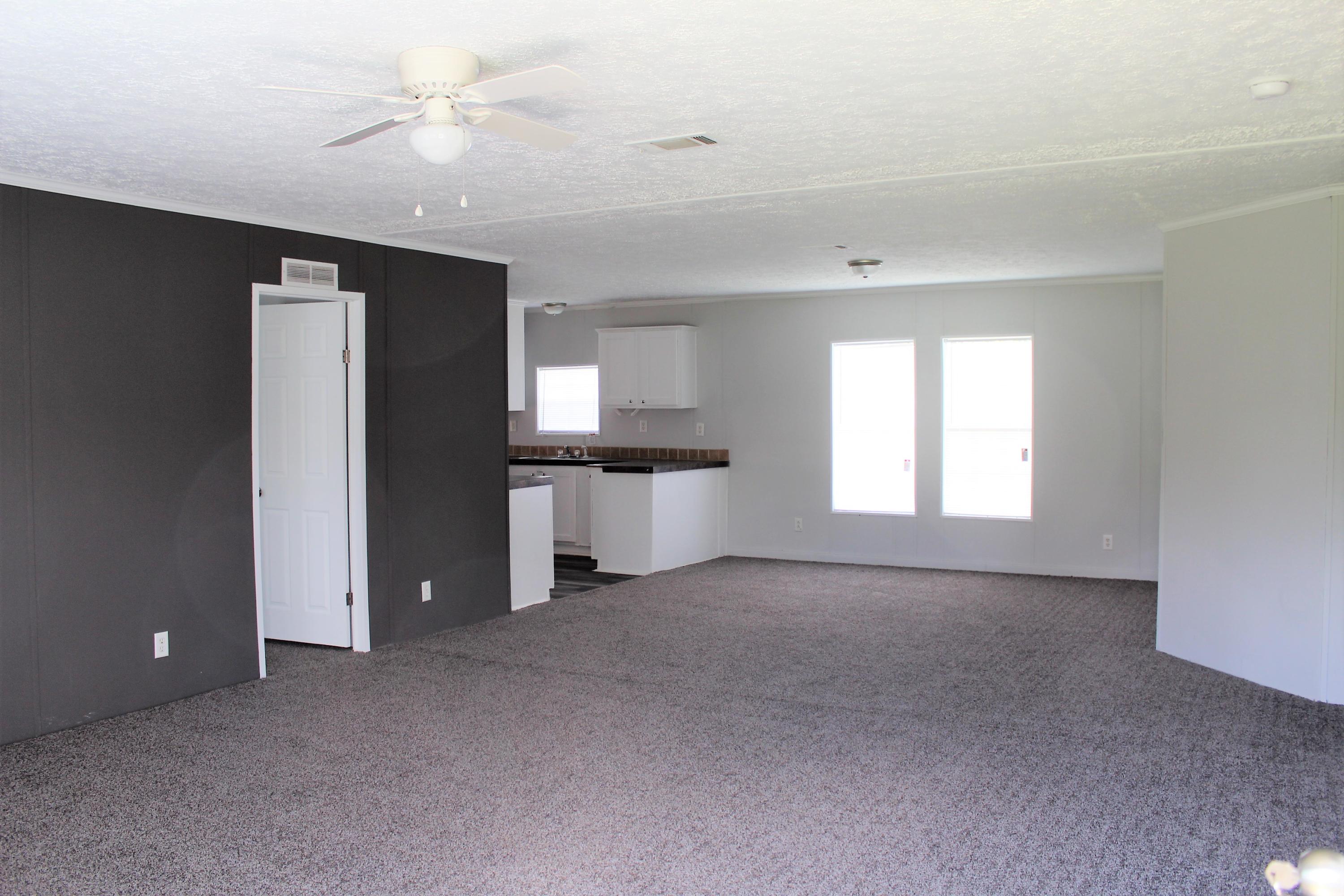 5072 Griffith Mill Road Holt, FL 32564 - Photo 3 of 22 a view of an empty room with a window