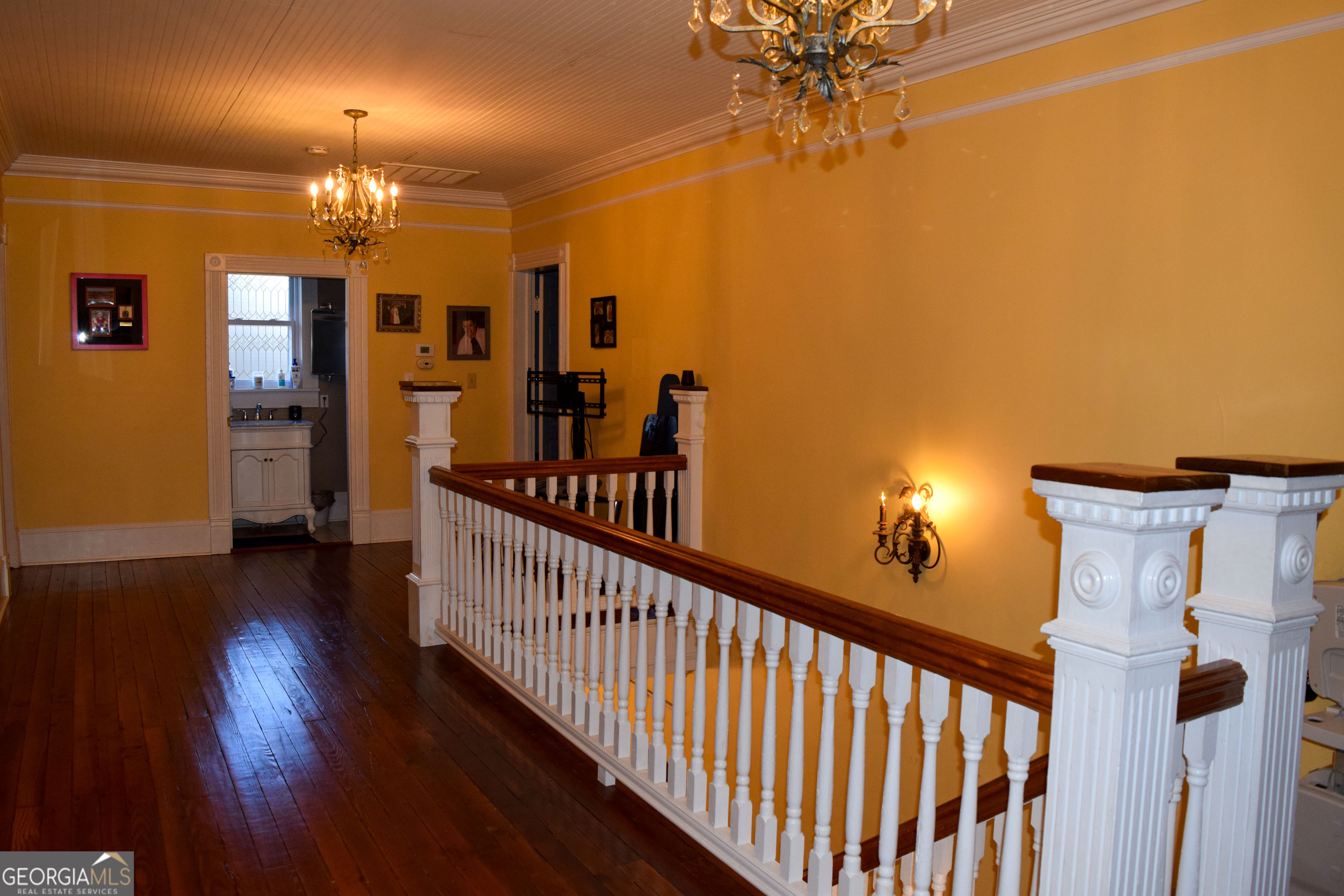 6464 Danburg Road Tignall, GA 30668 - Photo 11 of 23 a view of a livingroom with a furniture wooden floor and chandelier