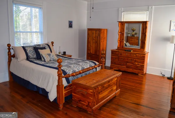 a bed room with a bed and a window