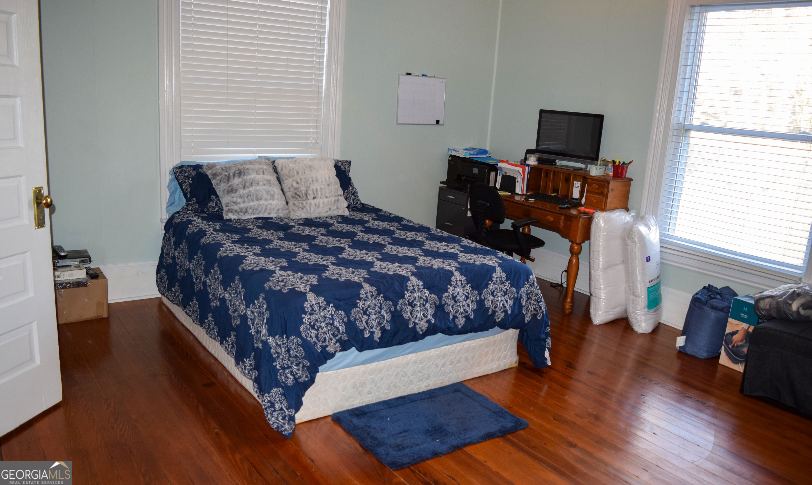 6464 Danburg Road Tignall, GA 30668 - Photo 15 of 23 a bedroom with a bed and a flat screen tv