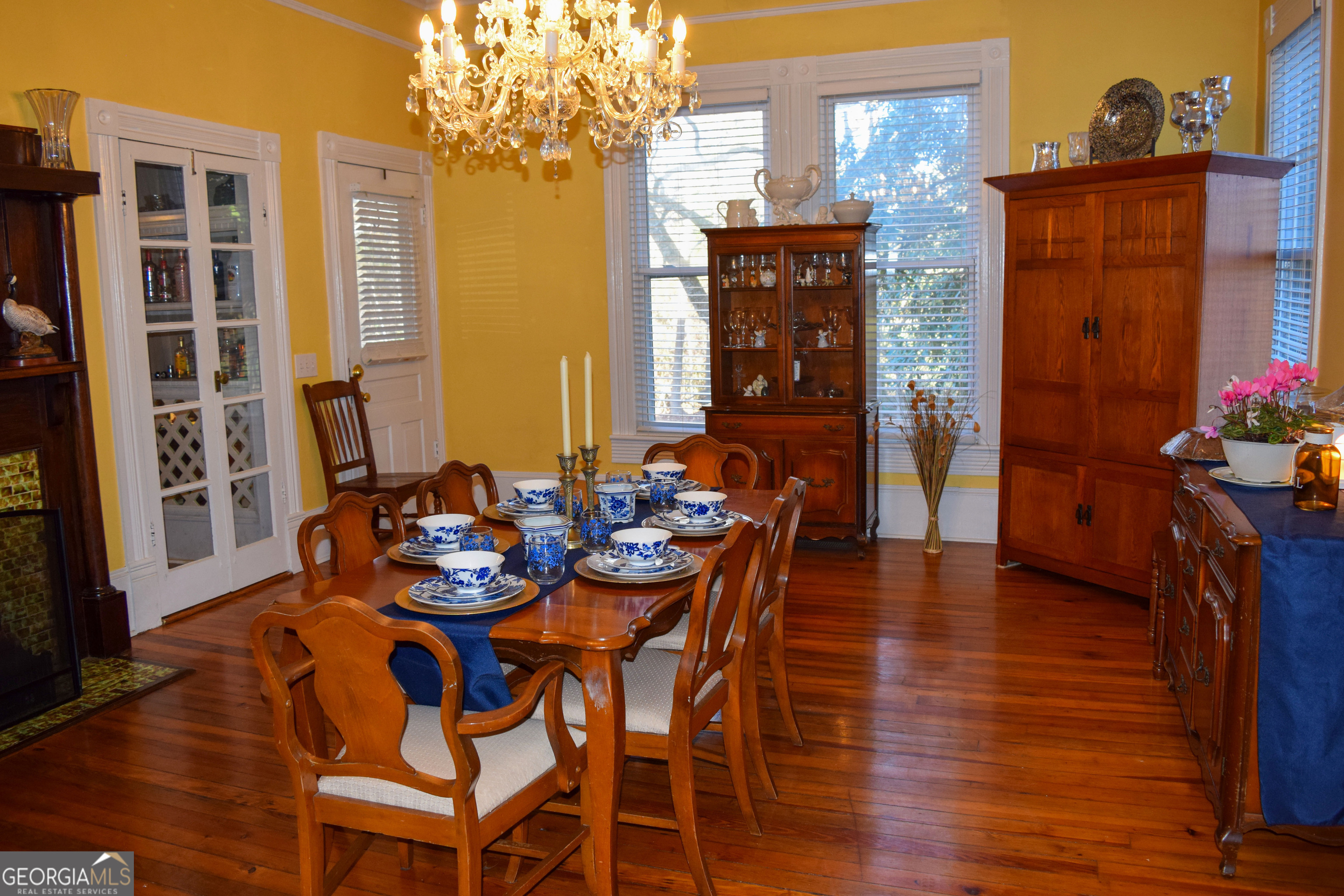 6464 Danburg Road Tignall, GA 30668 - Photo 8 of 23 a view of a dining room with furniture and chandelier