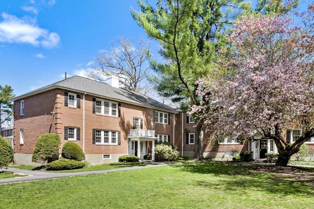 23 Hammond Pond Parkway, Unit 2 Newton, MA 02467 - Photo 1 of 21 a front view of a house with a yard