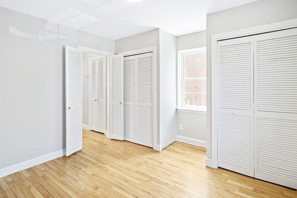 23 Hammond Pond Parkway, Unit 2 Newton, MA 02467 - Photo 13 of 21 a view of empty room with wooden floor
