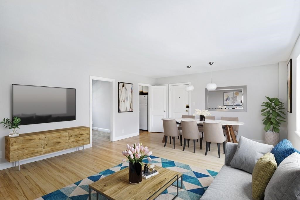 23 Hammond Pond Parkway, Unit 2 Newton, MA 02467 - Photo 6 of 21 a living room with furniture and wooden floor