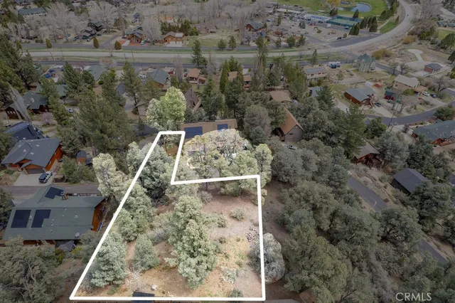 an aerial view of a house with a lake view