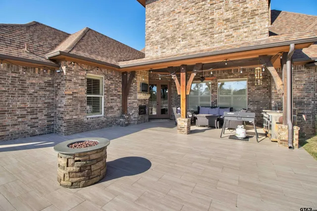 a view of a chairs and table in a patio