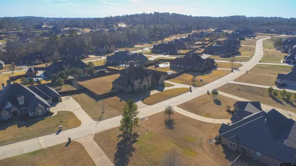 an aerial view of residential houses and outdoor space
