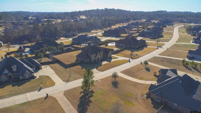 an aerial view of residential houses and outdoor space