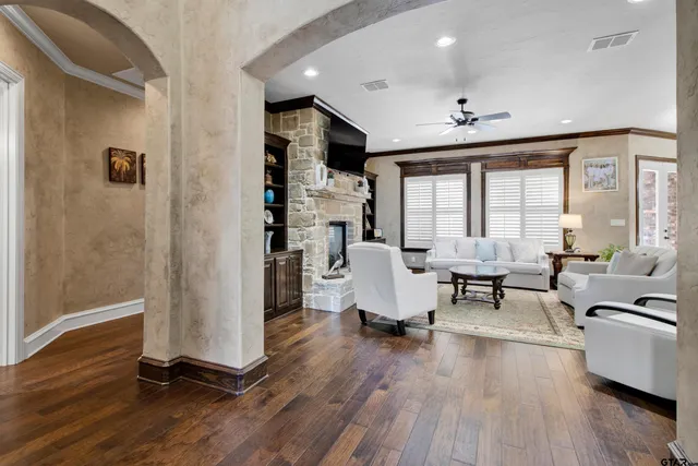 a view of a livingroom with furniture and a window