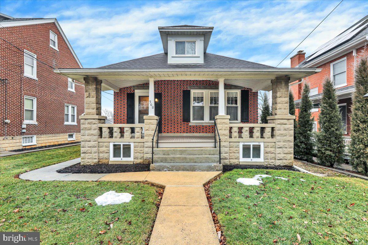 front view of a house with a yard