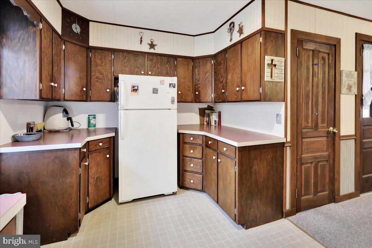 368 Donegal Springs Road Mount Joy, PA 17552 - Photo 21 of 27 a kitchen with stainless steel appliances granite countertop a refrigerator a stove top oven a sink and dishwasher