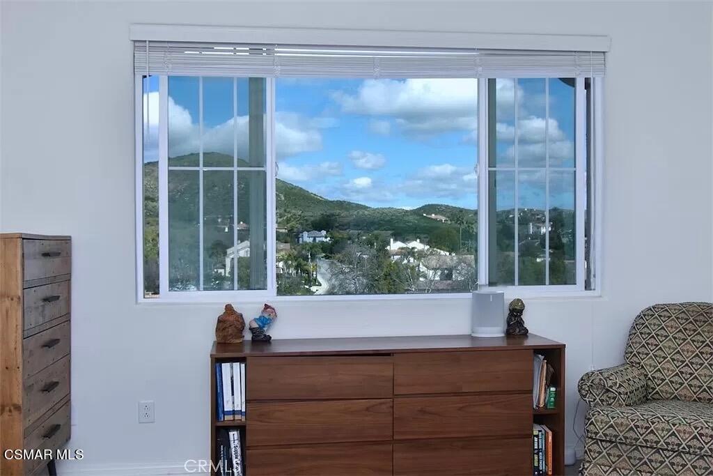 207 Morro Way, Unit 3 Simi Valley, CA 93065 - Photo 21 of 31 a room with a couch and large windows