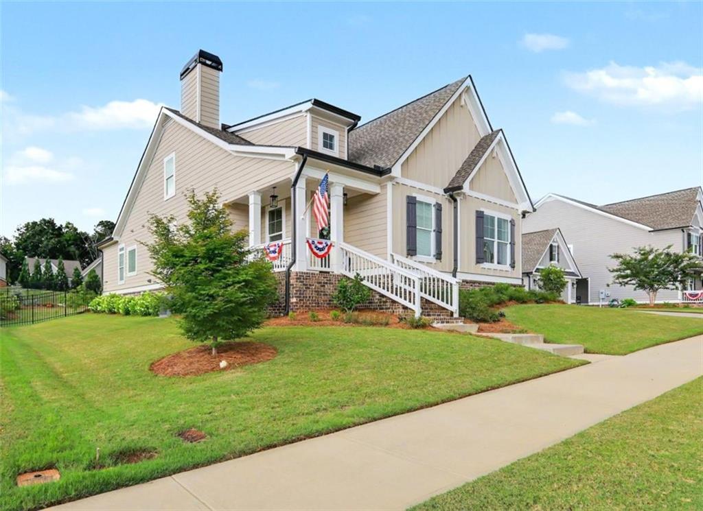 943 Clubside Drive Monroe, GA 30655 - Photo 2 of 93 a front view of a house with a yard