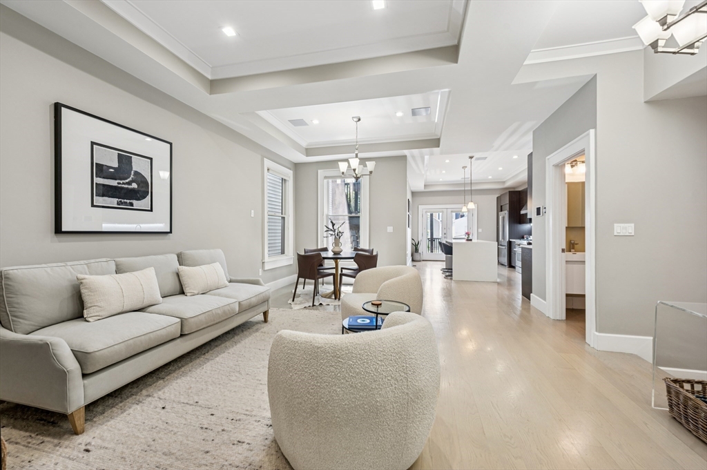 27 Mercer Street, Unit 1 Boston, MA 02127 - Photo 1 of 21 a living room with furniture and a large window