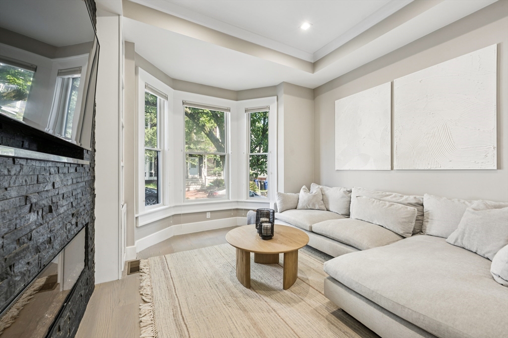 27 Mercer Street, Unit 1 Boston, MA 02127 - Photo 11 of 21 a living room with furniture and a large window