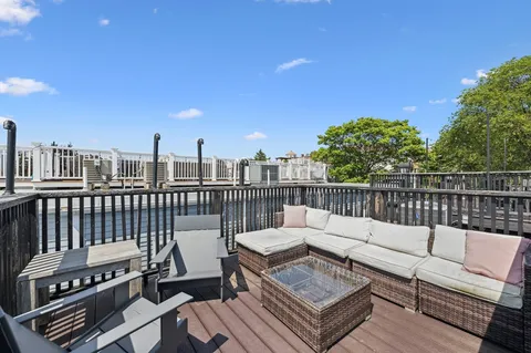 a view of a roof deck with couches