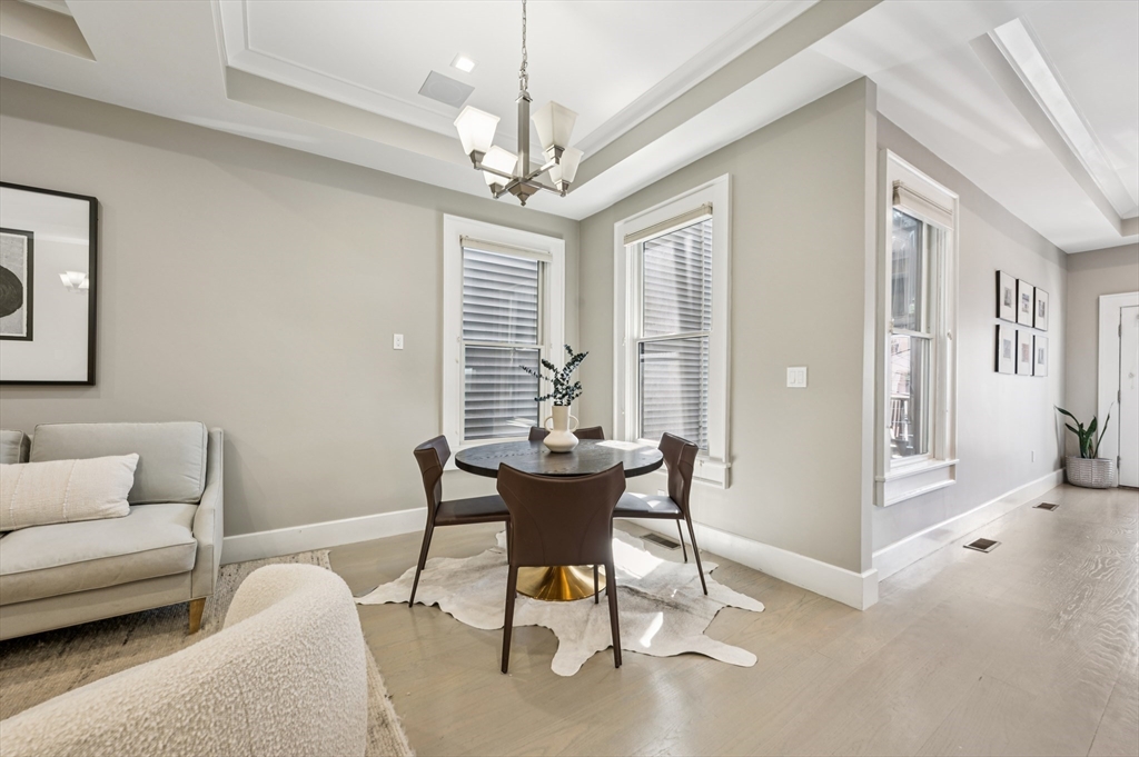 27 Mercer Street, Unit 1 Boston, MA 02127 - Photo 10 of 21 a living room with furniture and a chandelier