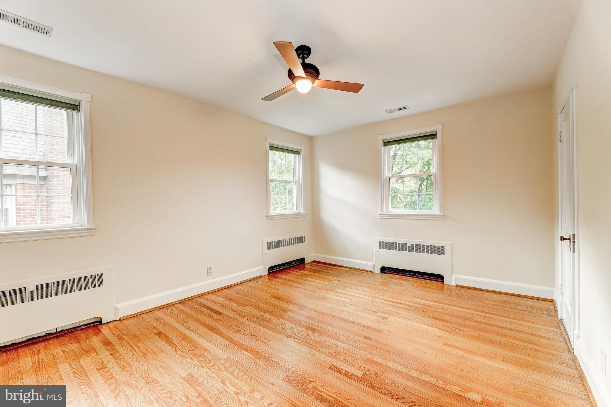 47 Dunkirk Road Baltimore, MD 21212 - Photo 16 of 43 Primary bedroom with wood floors & ceiling fan