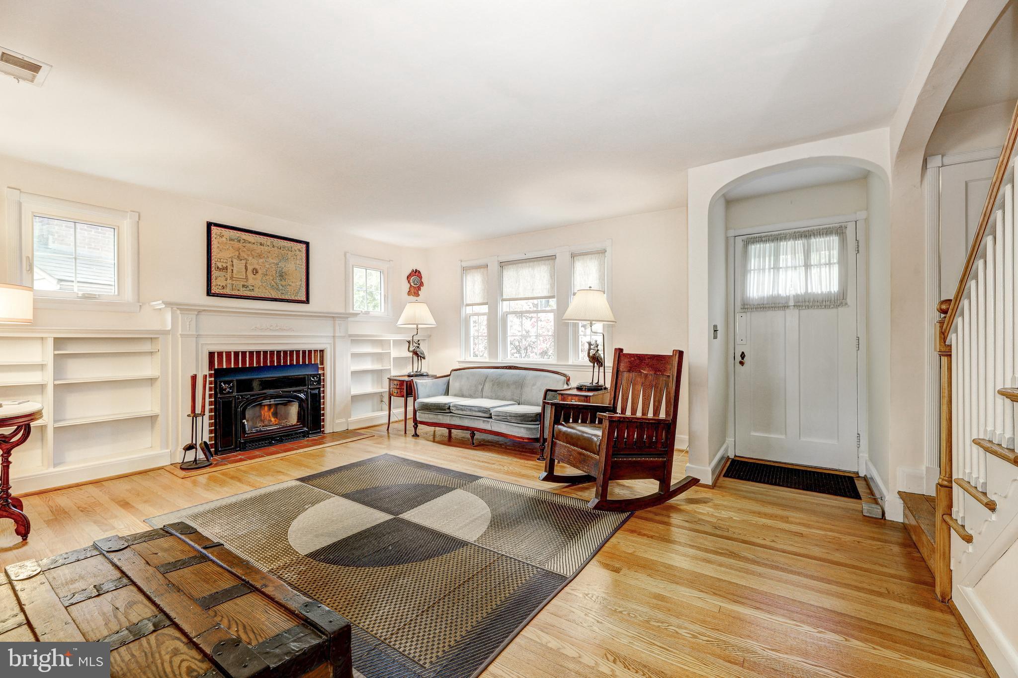 47 Dunkirk Road Baltimore, MD 21212 - Photo 6 of 43 Wood burning fireplace flanked by windows