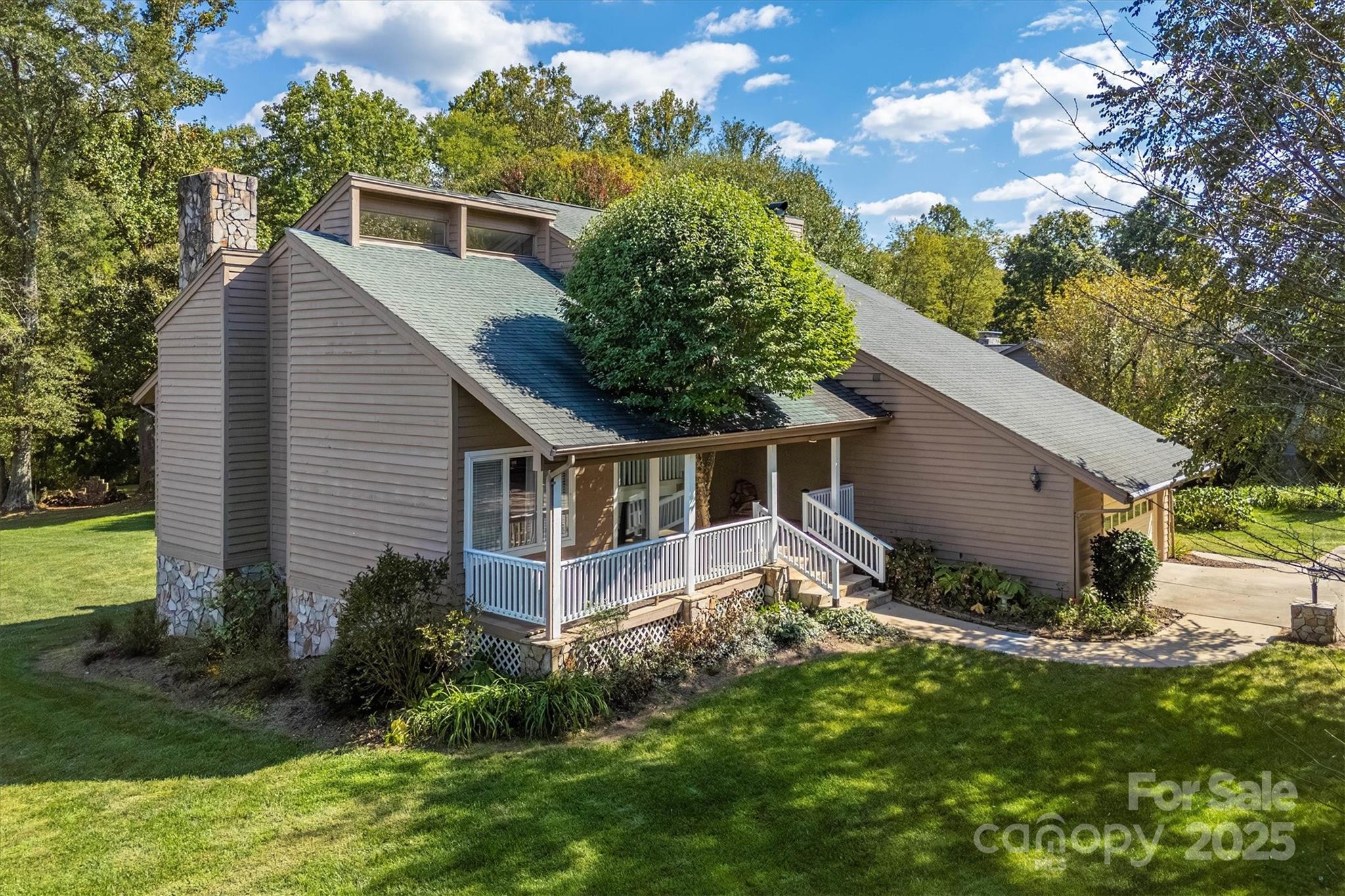 a view of a house with a yard and plants