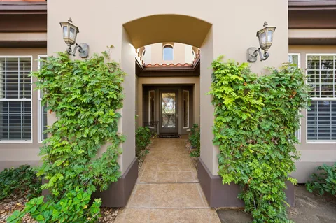 a view of a entryway with flower pots