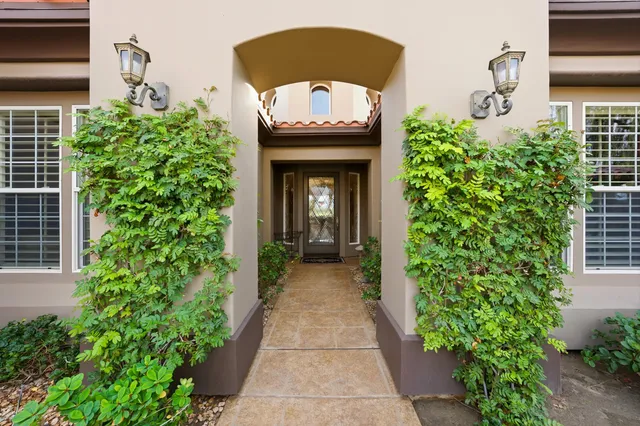 a spacious bedroom with a bed and a couch