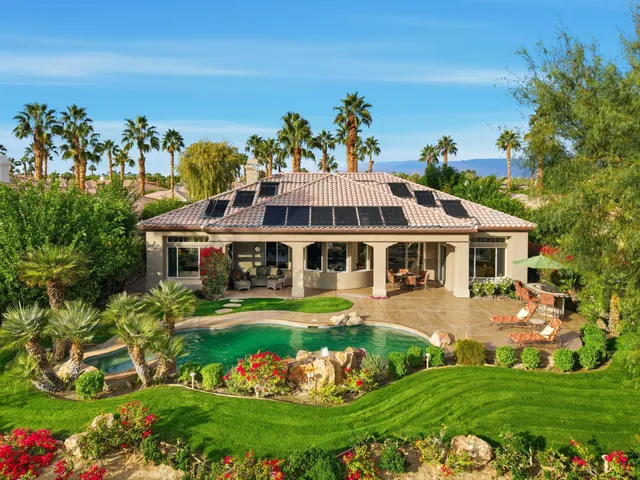 a view of a swimming pool with a patio