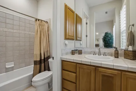 a view of a lake with houses in the back