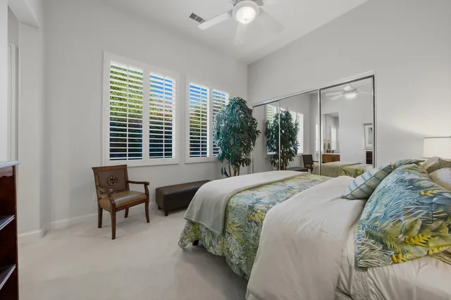 a view of a lake with houses in the back