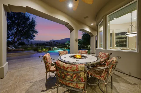 a outdoor space with furniture and city view