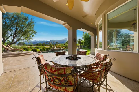 a dining area with furniture and outdoor view