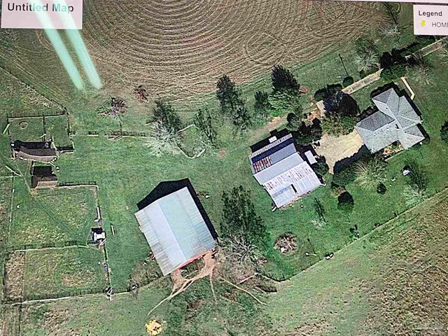 a view of a town with large trees