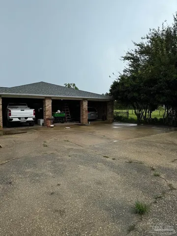 a view of a car park in front of house