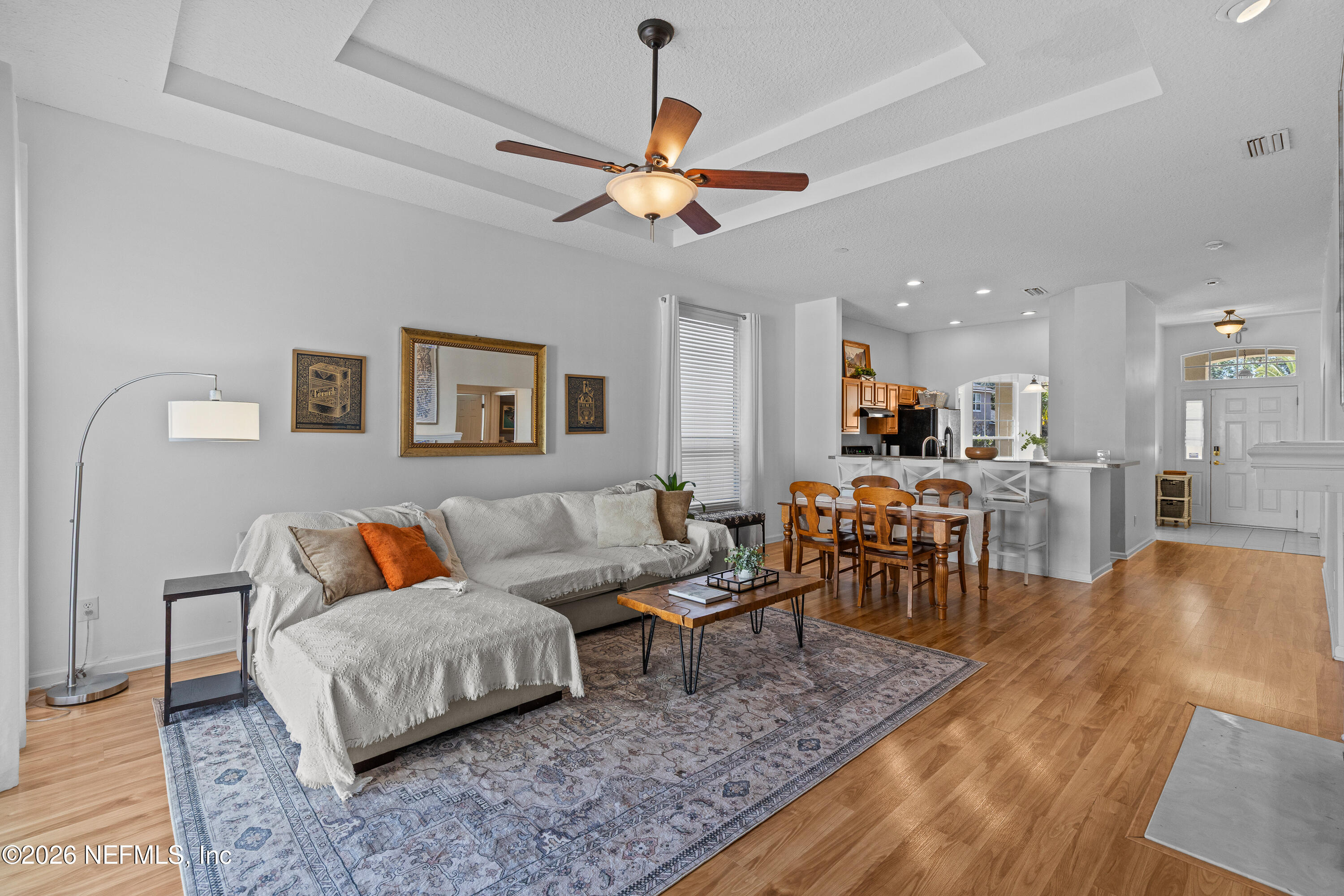 827 Briarcreek Road Jacksonville, FL 32225 - Photo 12 of 44 a living room with furniture kitchen view and a dining table