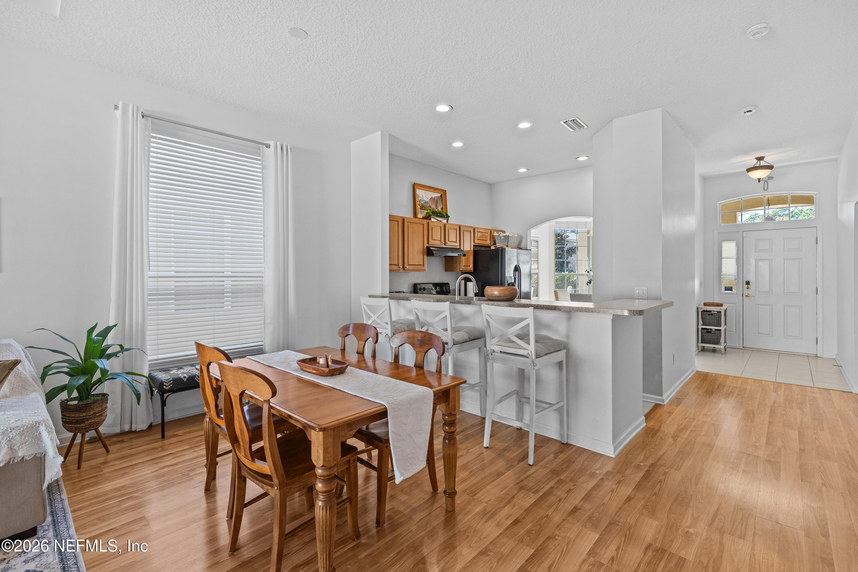 827 Briarcreek Road Jacksonville, FL 32225 - Photo 14 of 44 a view of a dining room with furniture and wooden floor
