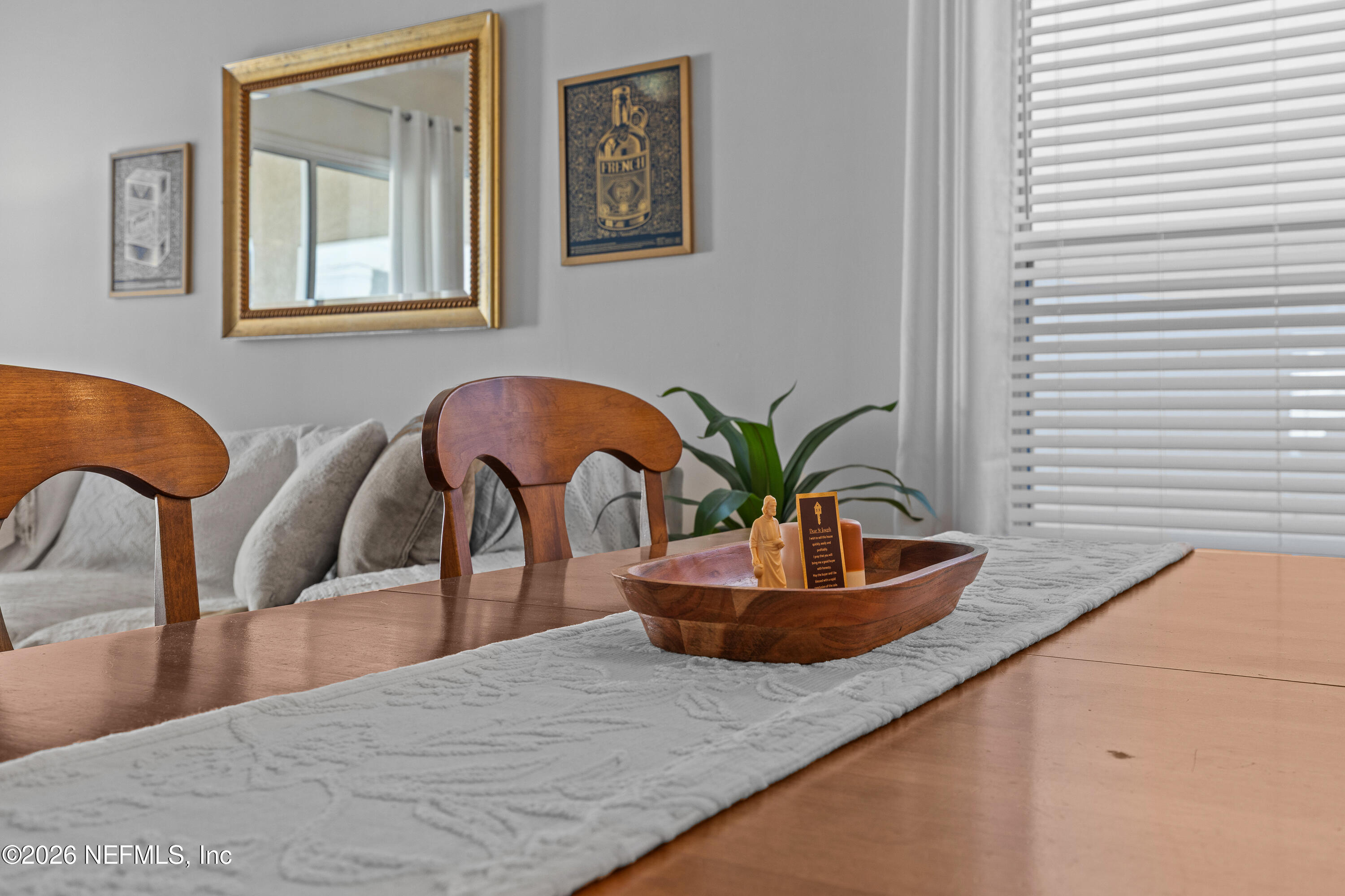 827 Briarcreek Road Jacksonville, FL 32225 - Photo 16 of 44 a living room with furniture and a potted plant