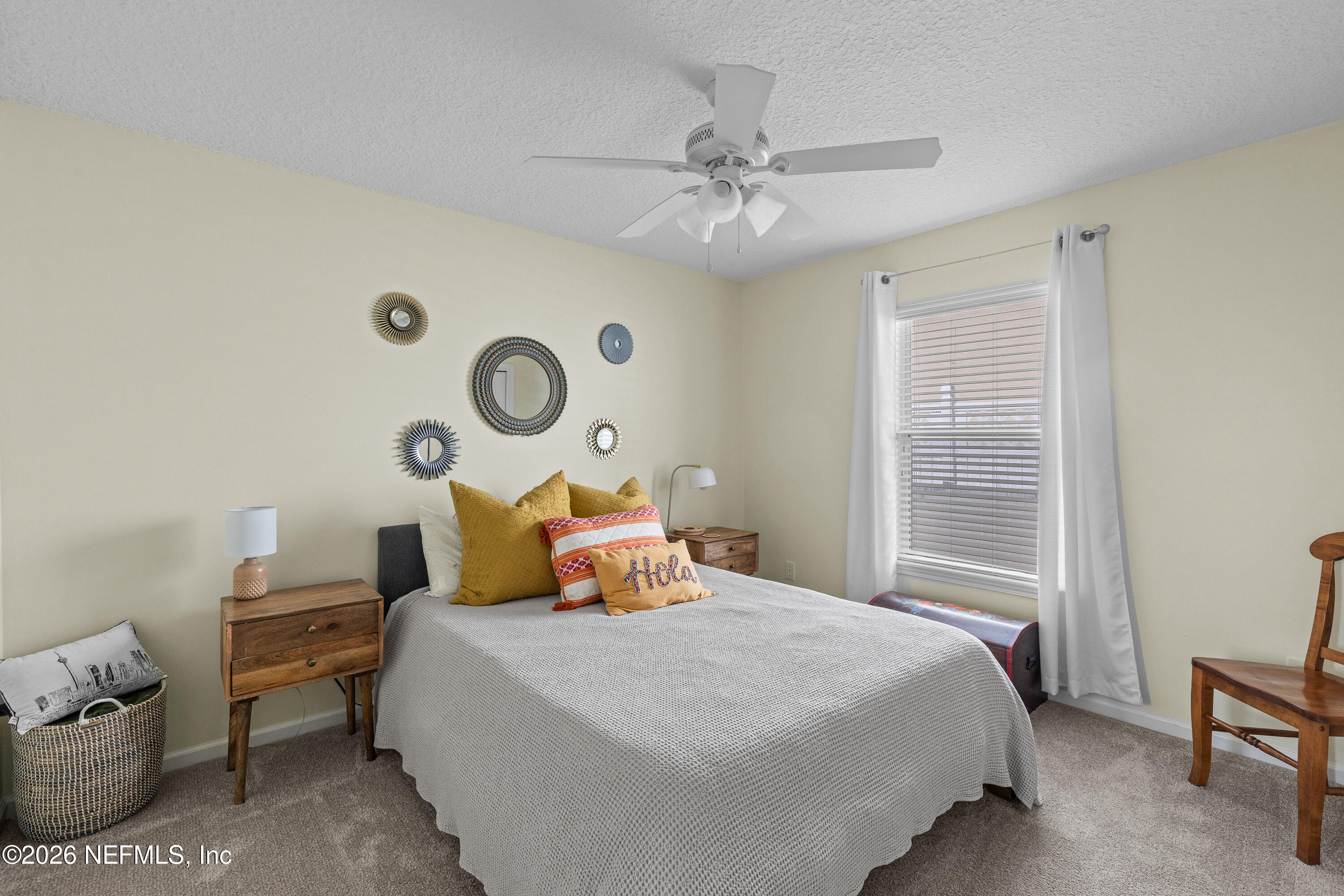 827 Briarcreek Road Jacksonville, FL 32225 - Photo 17 of 44 a bedroom with a bed and a lamp with window