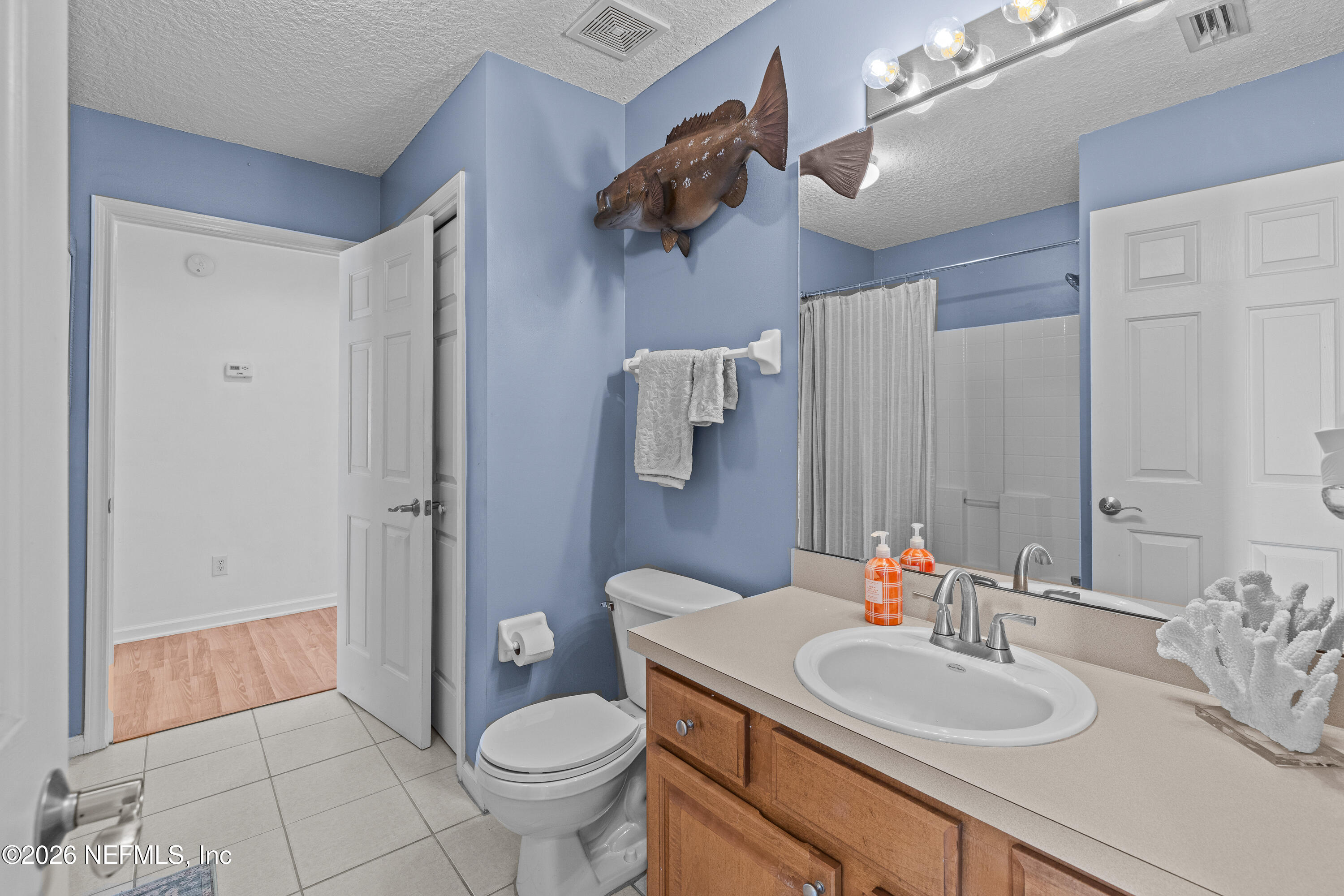 827 Briarcreek Road Jacksonville, FL 32225 - Photo 21 of 44 a bathroom with a sink toilet and shower