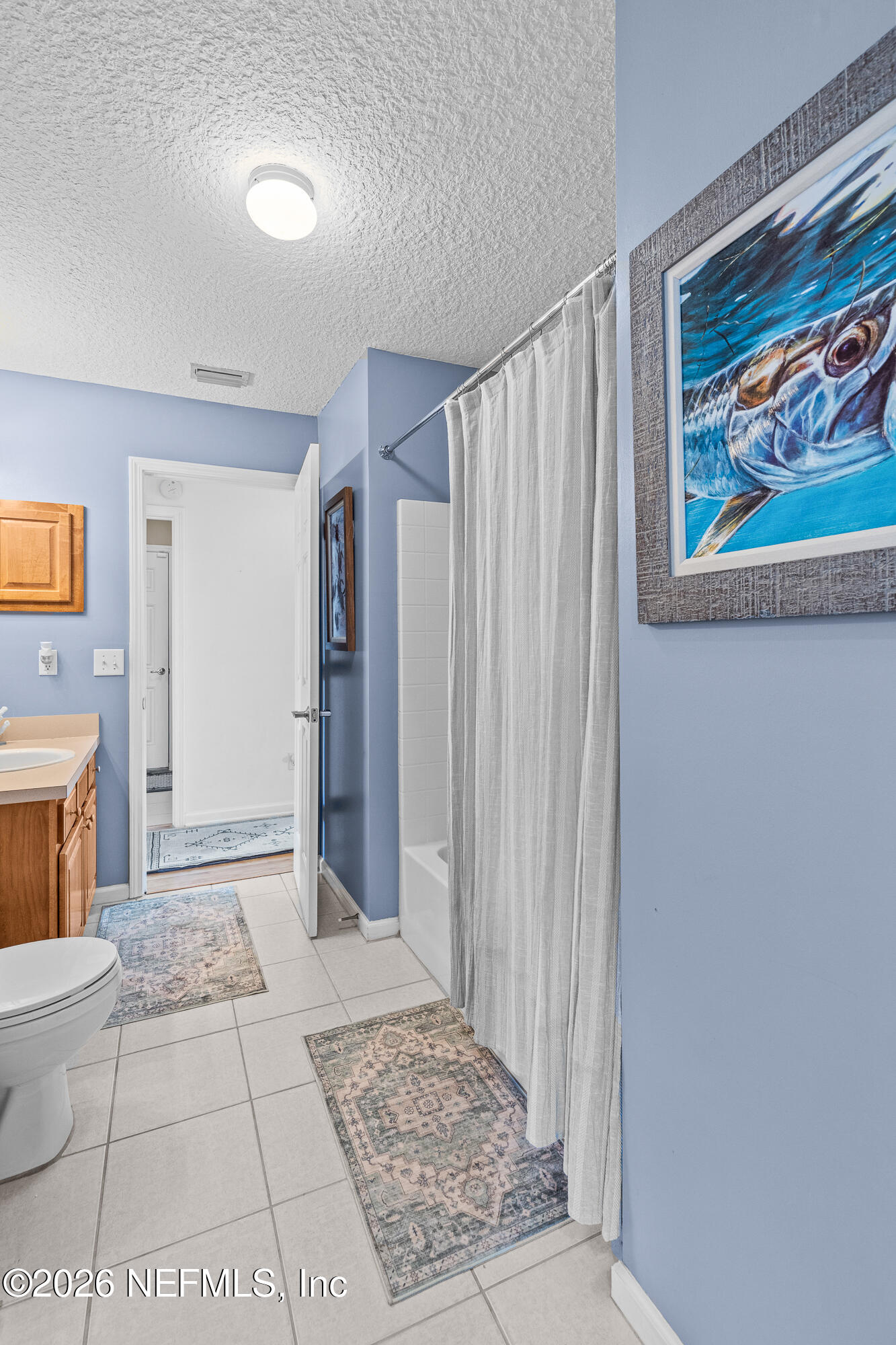 827 Briarcreek Road Jacksonville, FL 32225 - Photo 22 of 44 a view of a hallway with wooden floor and a fireplace