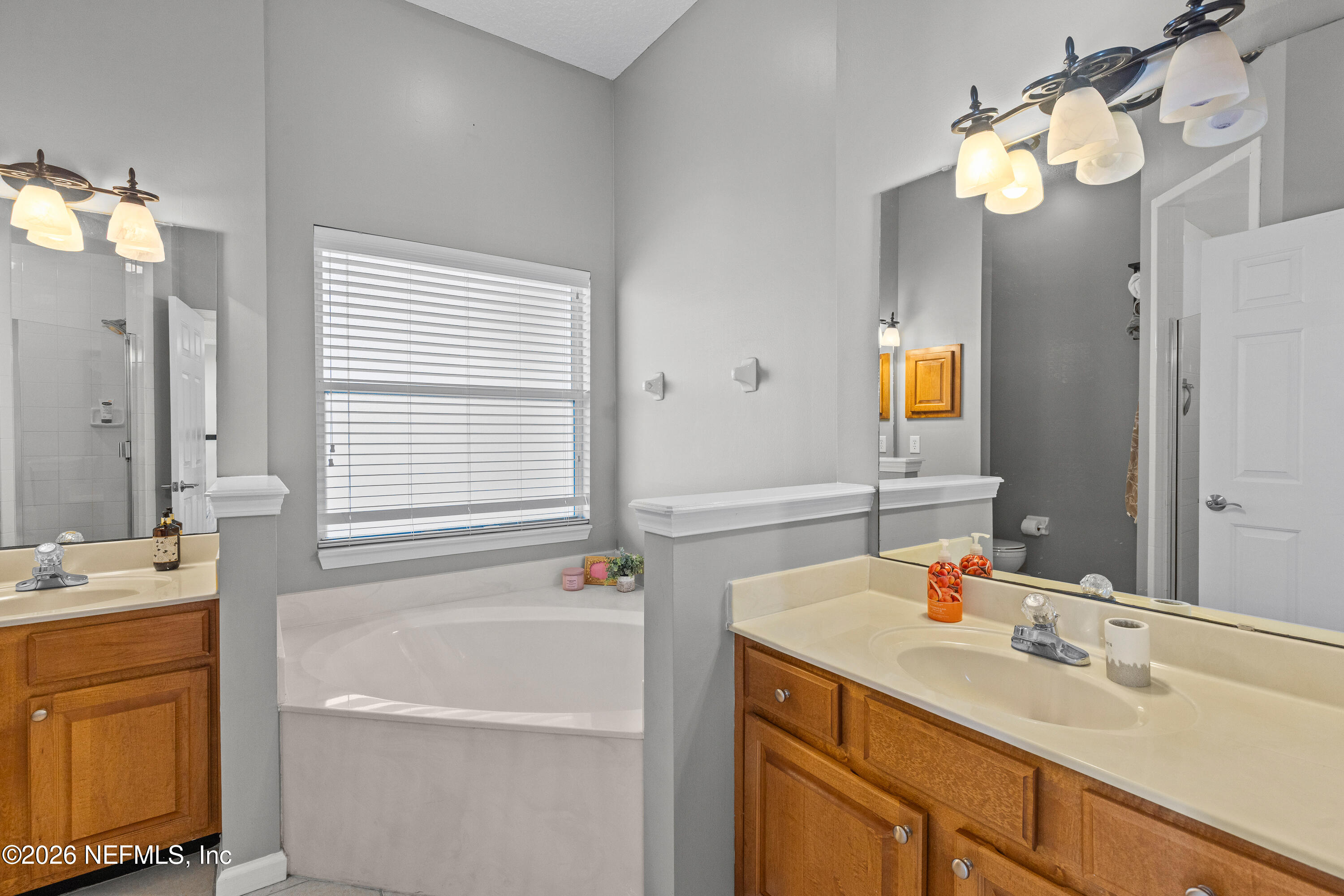 827 Briarcreek Road Jacksonville, FL 32225 - Photo 27 of 44 a bathroom with a sink double vanity and a mirror