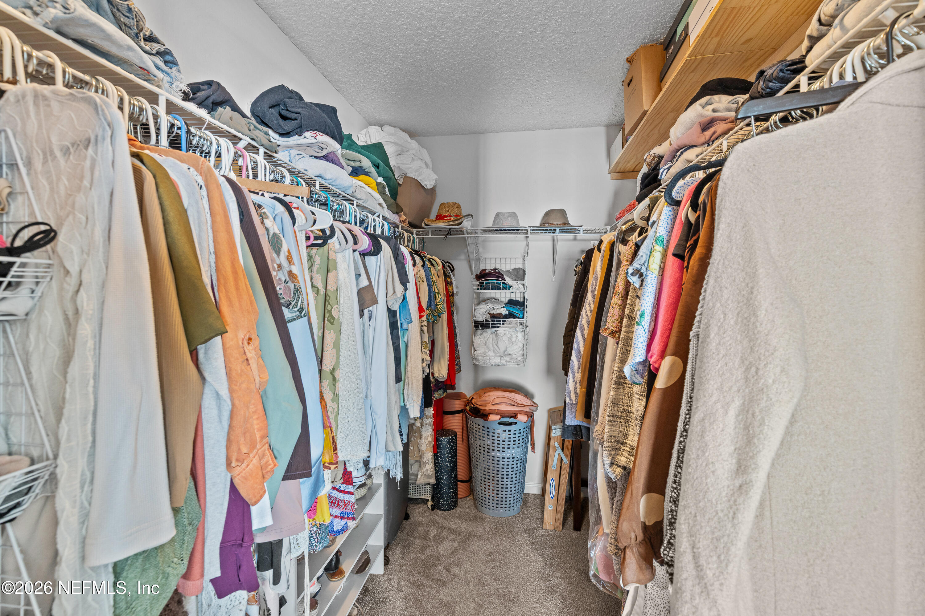 827 Briarcreek Road Jacksonville, FL 32225 - Photo 30 of 44 a view of walk in closet with clothes