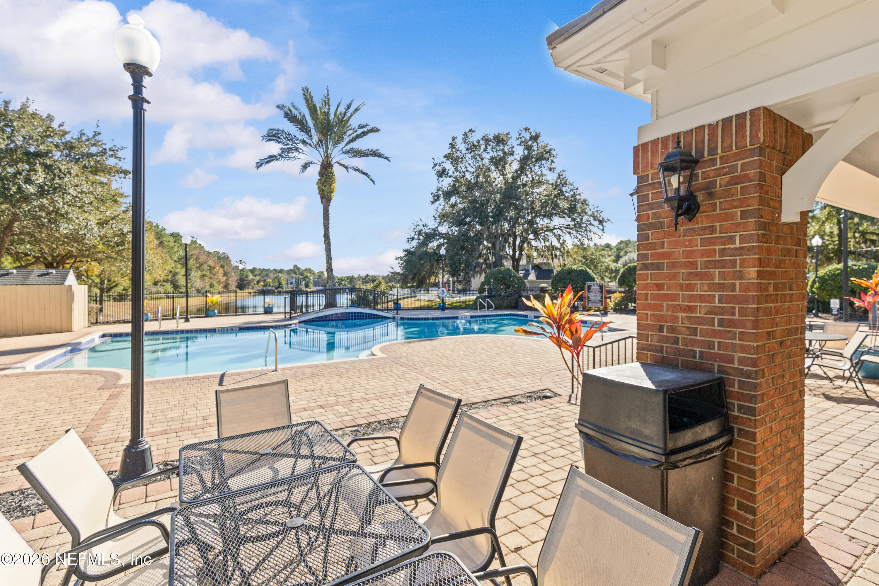 827 Briarcreek Road Jacksonville, FL 32225 - Photo 40 of 44 a view of a swimming pool with a lounge chairs